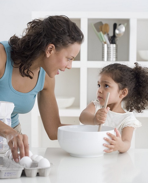 Mom and daughter cooking together