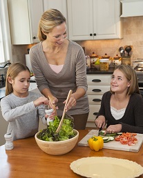 Mom and kids cooking together